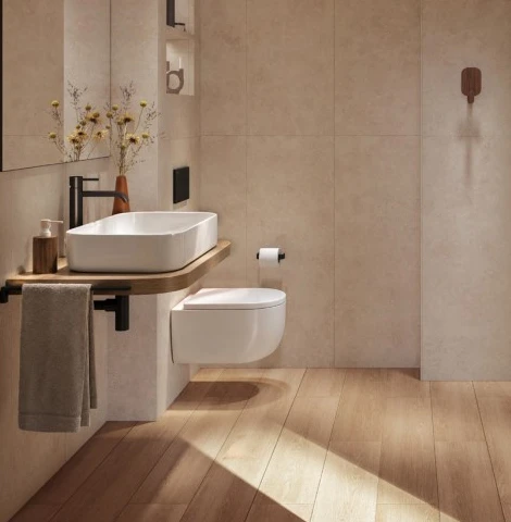 Baño con lavabo sobre encimera de madera