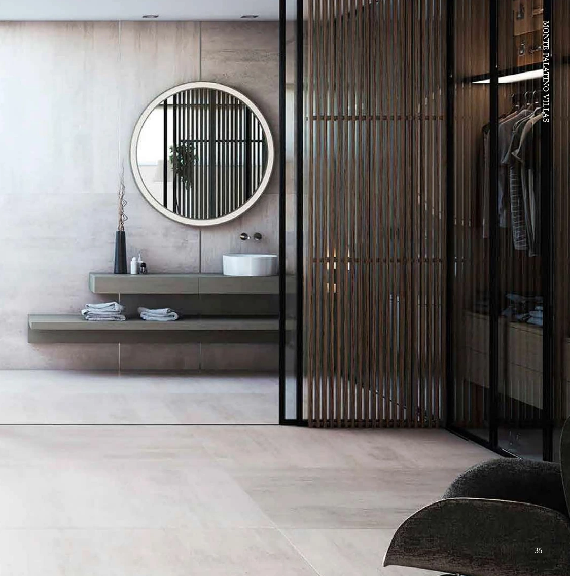 Baño principal con espejo redondo y vestidor