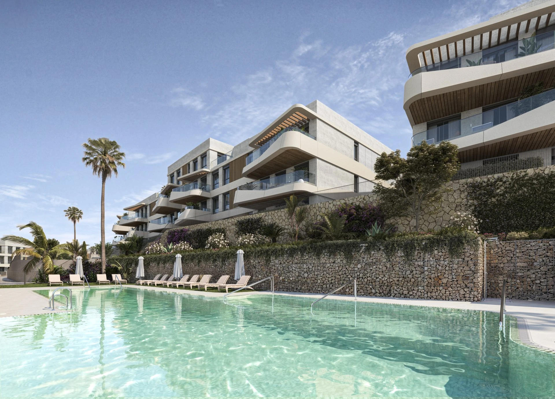 Piscina exterior y zonas comunes ajardinadas