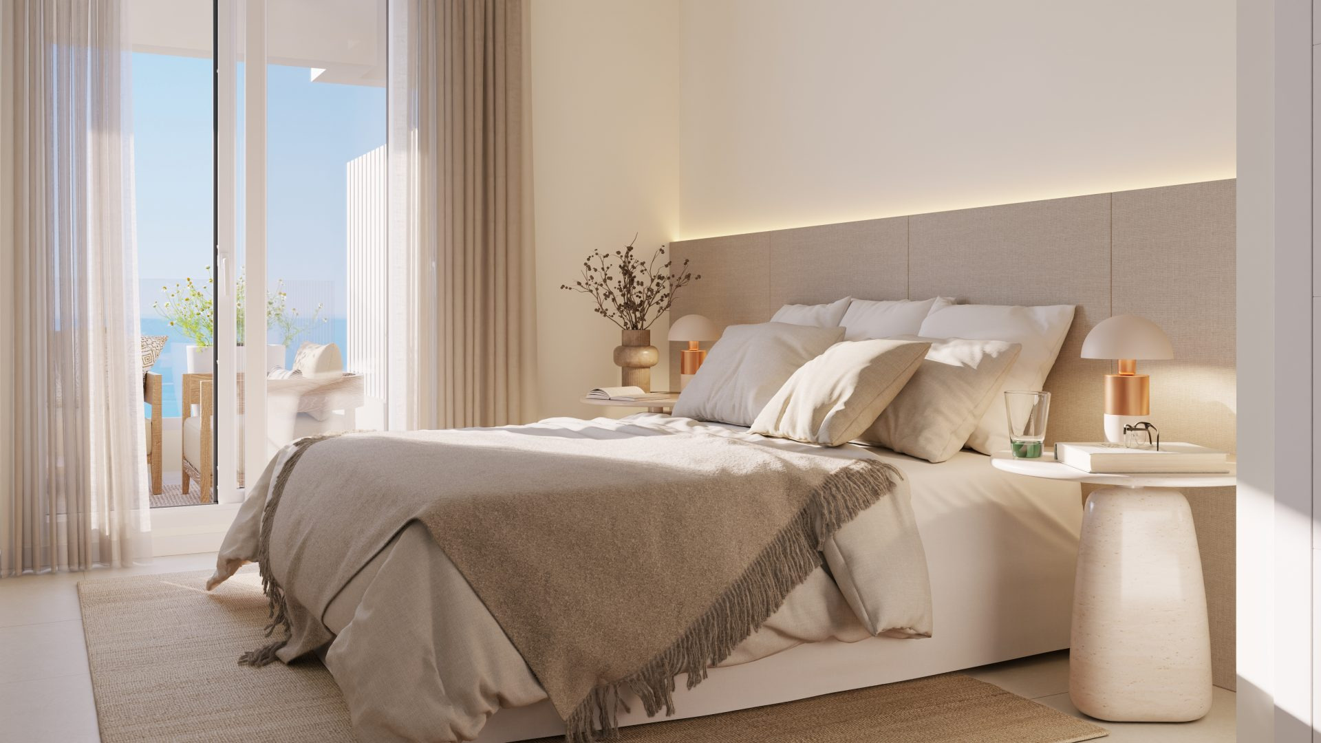 Dormitorio principal en tonos cálidos con salida a la terraza y vistas al mar