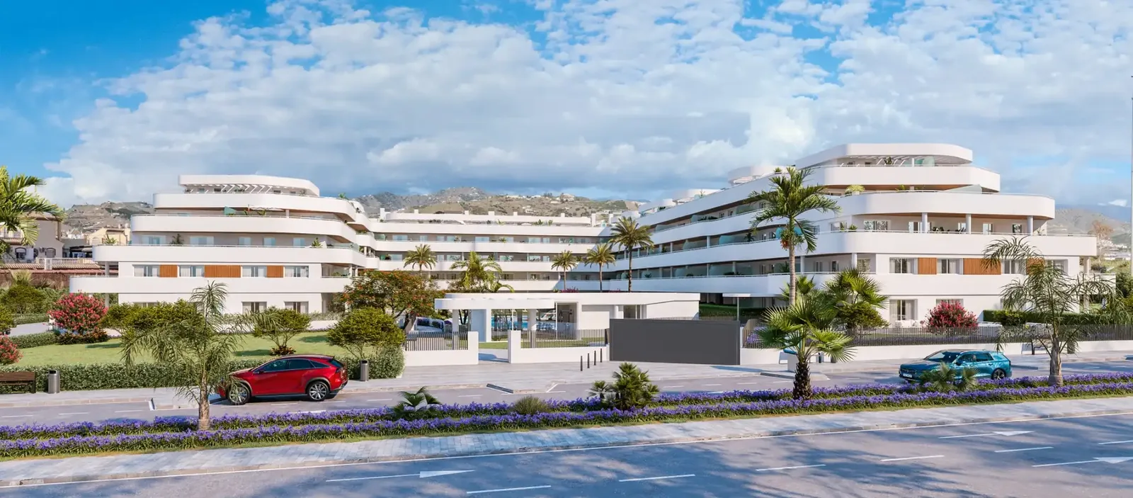 Fachada de la promoción con piscina y zonas ajardinadas en Torrox